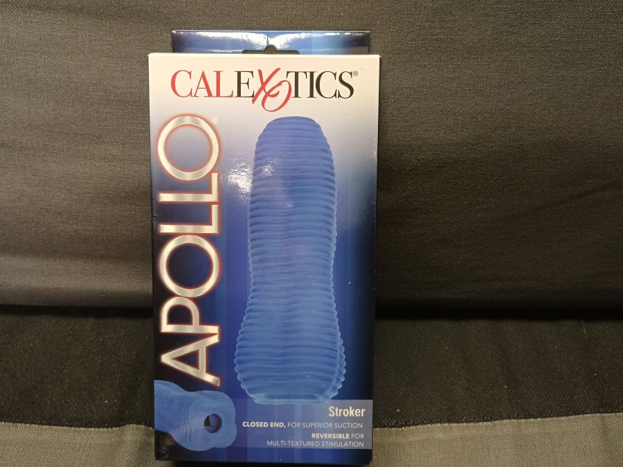 The CalExotics Apollo stroker laying against a pillow.