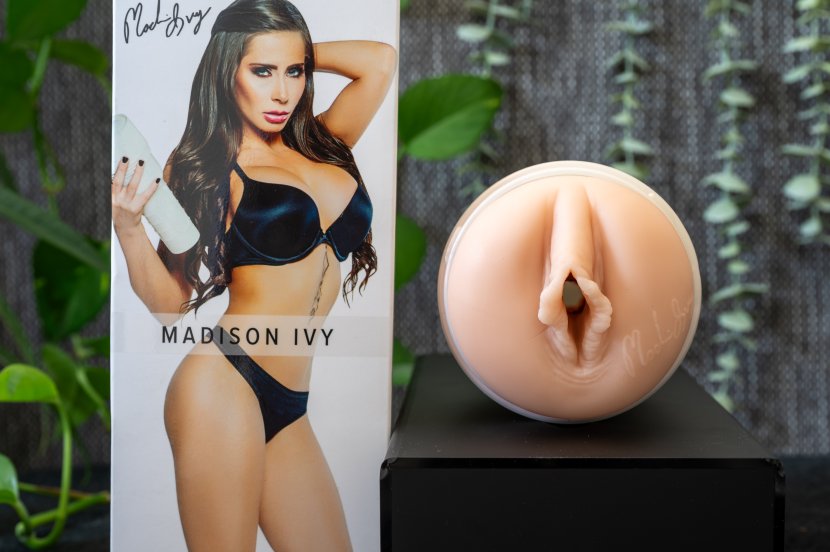 Pictured is the Fleshlight Madison Ivy Beyond with its packaging next to the toy. Pictured is the Fleshlight Madison Ivy Beyond with its packaging next to the toy.