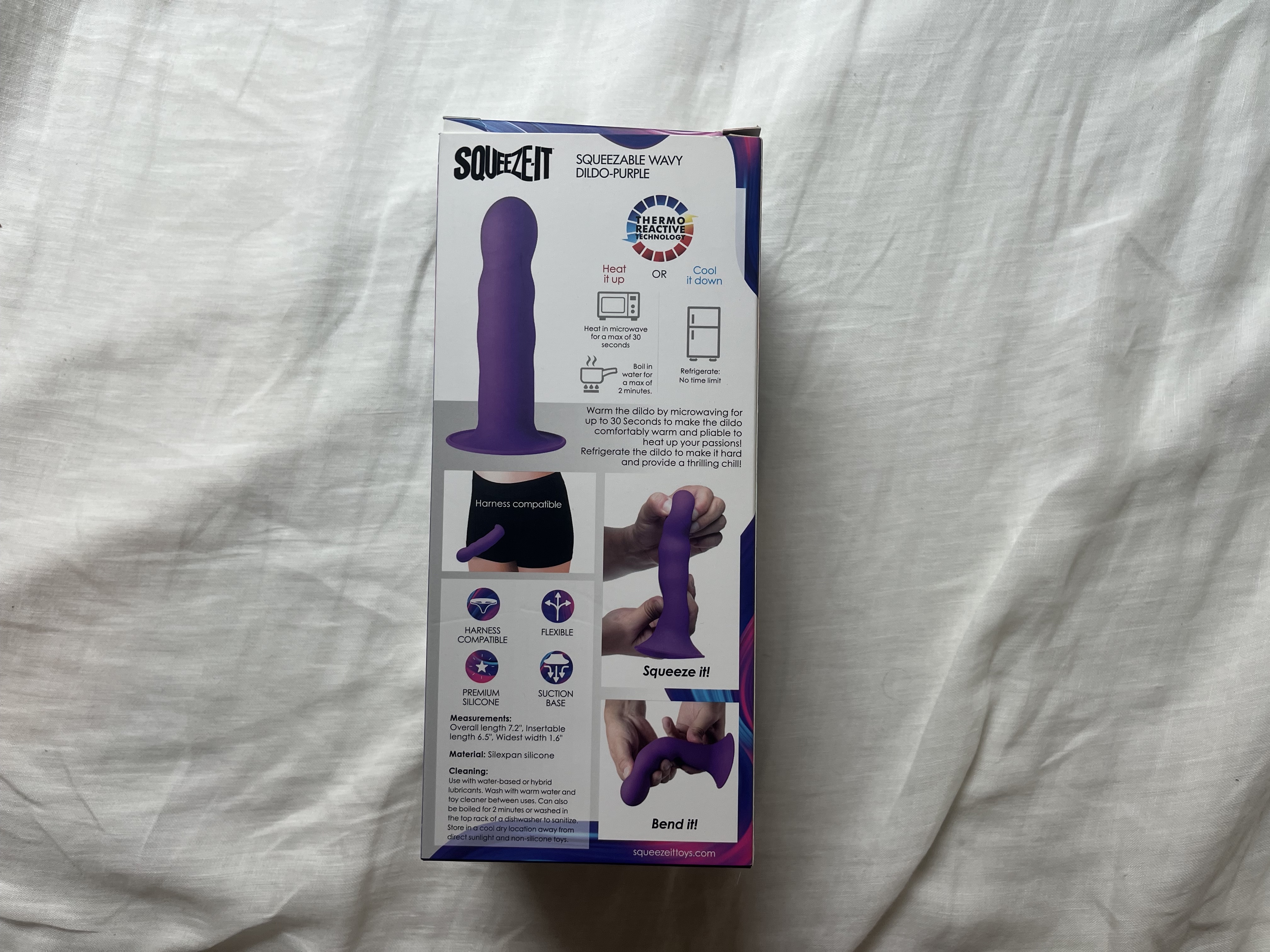 The photo shows a cardboard box with the Squeeze-It Wavy Dildo instruction manual. The photo shows a cardboard box with the Squeeze-It Wavy Dildo instruction manual.