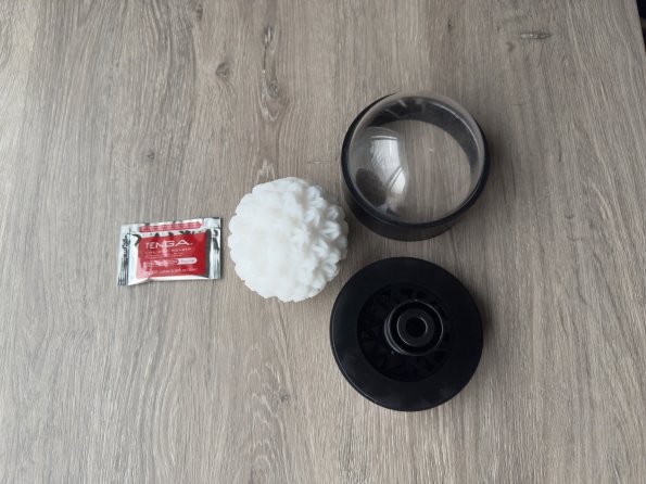 Featured are all the elements included in the packaging of the Tenga Geo Coral penis toy.