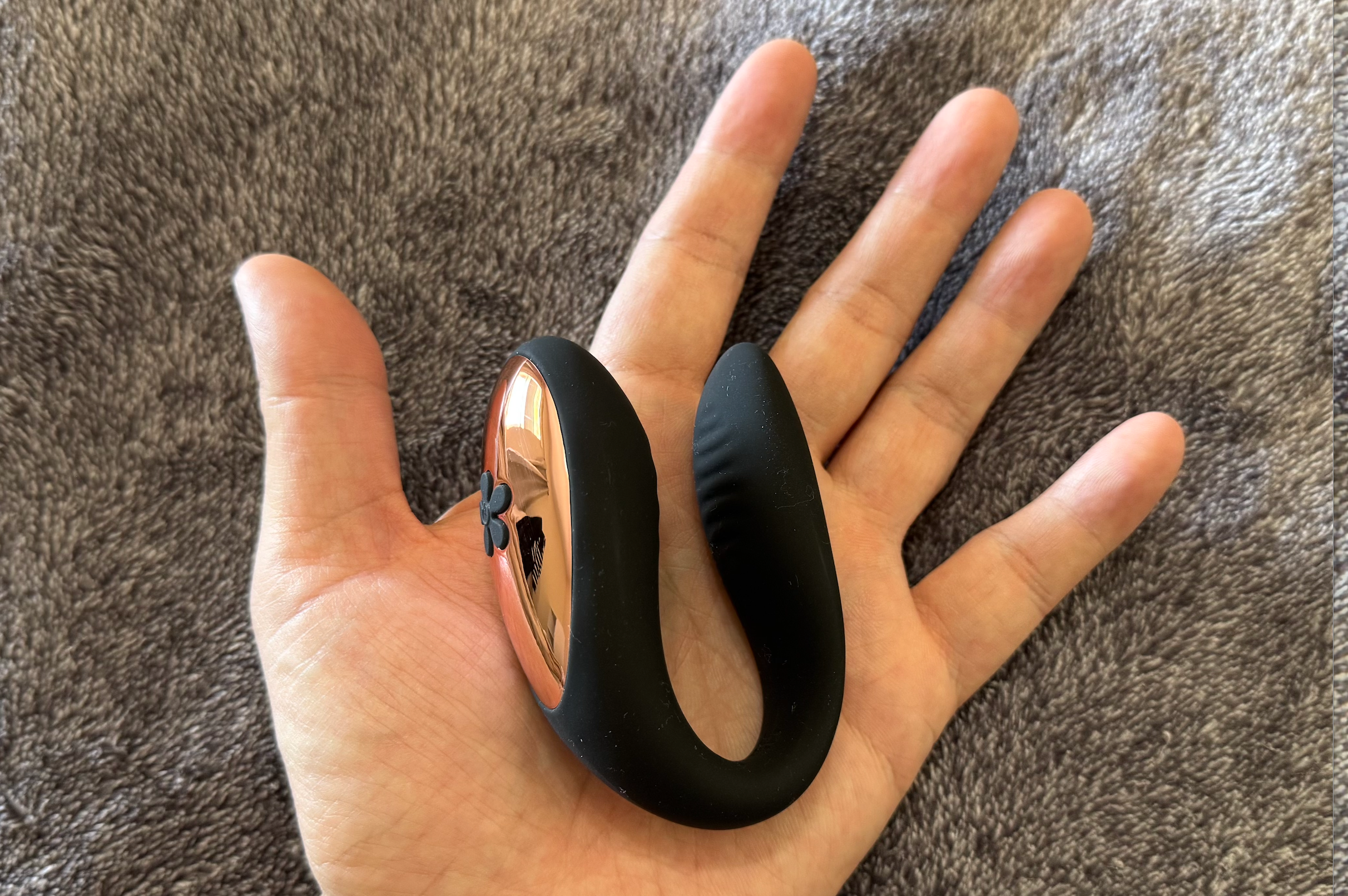 Pictured is the Harmonix Duo Pulse Couples App Control Vibe from Our Erotic Journey in a hand for size reference. Pictured is the Harmonix Duo Pulse Couples App Control Vibe from Our Erotic Journey in a hand for size reference.