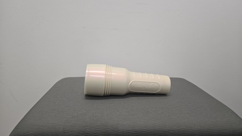 A Fleshlight case laying flat.