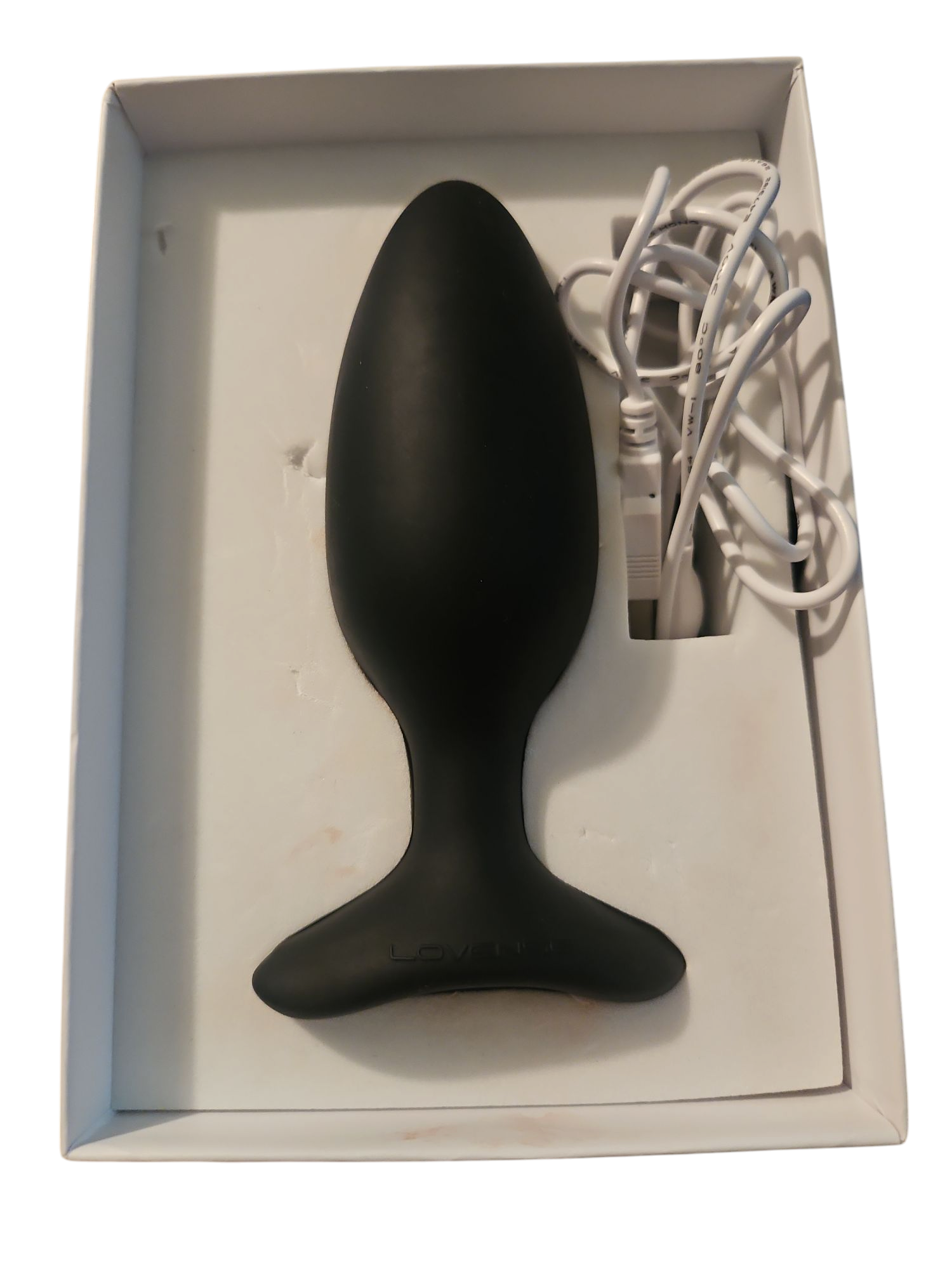 Pictured is the The Lovense Hush 2 with its charging cable.