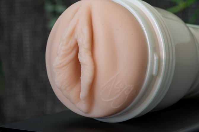 Pictured is the Fleshlight Elsa Jean sleeve from a side angle that showcases the ridges and valleys of her entryway.