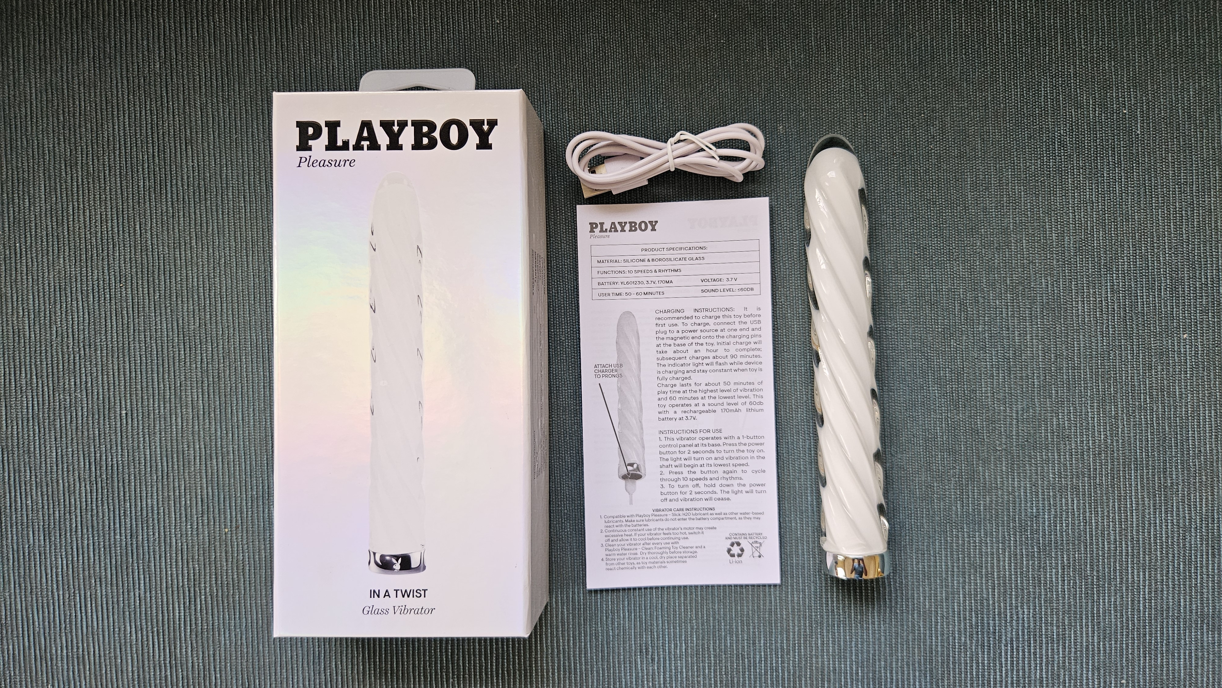 Open box of Playboy Pleasure In A Twist Glass Vibrator.