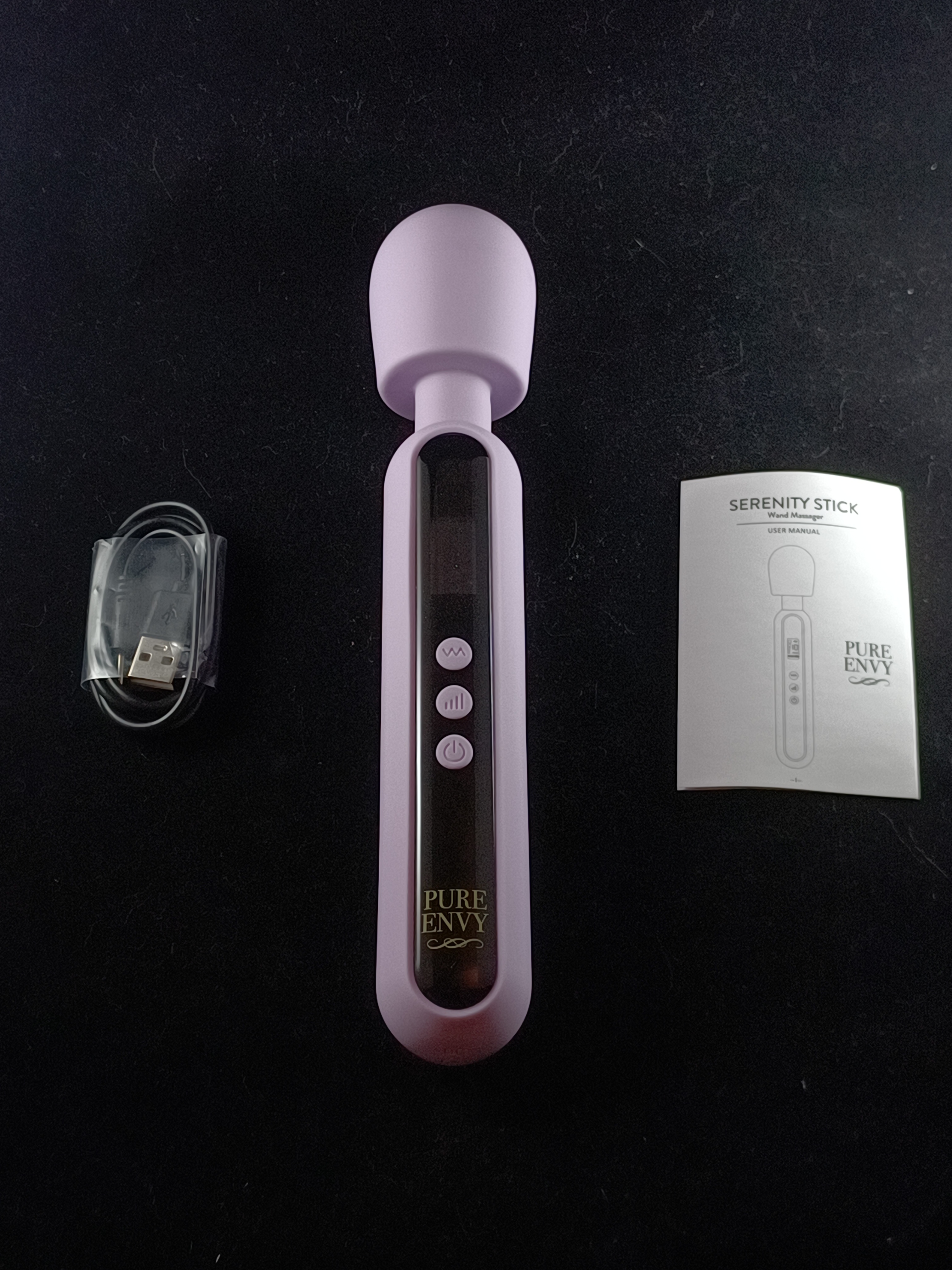 Pictured here is the Pure Envy Serenity Stick with an instruction manual and charging adapter. Pictured here is the Pure Envy Serenity Stick with an instruction manual and charging adapter.