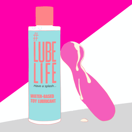 A lubed up vibrator leans against a bottle of lube. A lubed up vibrator leans against a bottle of lube.