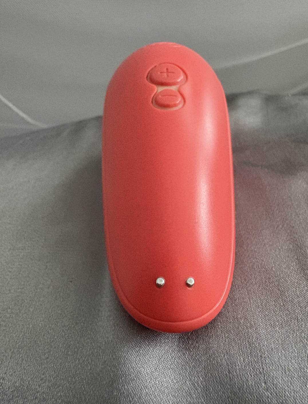 The charger is magnetic and connects to the two dotted prongs along the bottom of the Starlet 2. The charger is magnetic and connects to the two dotted prongs along the bottom of the Starlet 2.