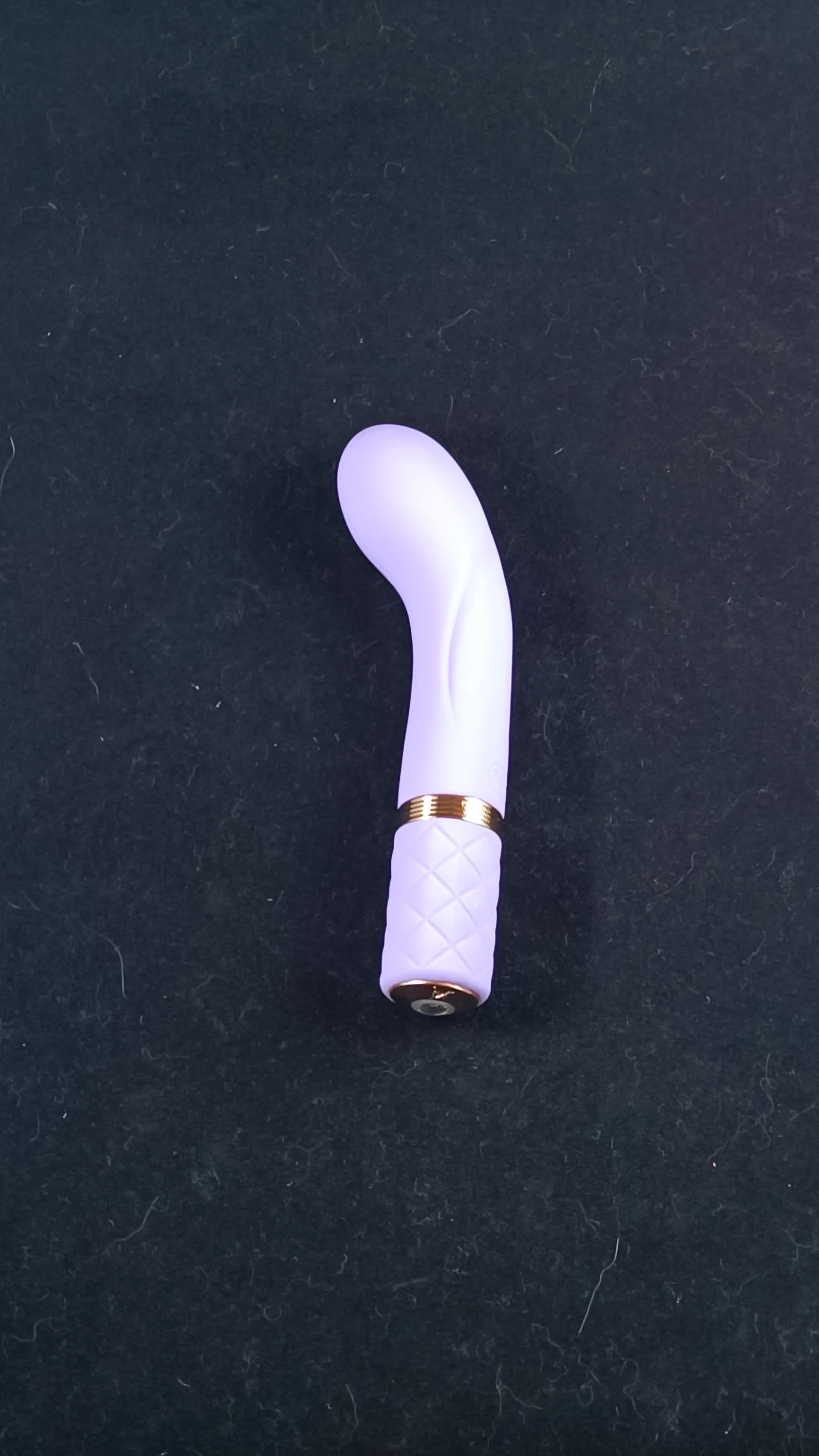 Pictured is the Pillow Talk Racy Special Edition Silicone G-Spot Vibrator and its travel lock feature.
